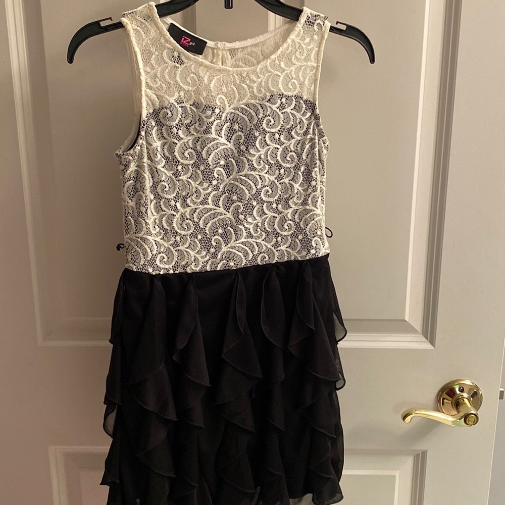 Beautiful girl holiday dress. Cream lace top with black ruffle bottom. Worn once